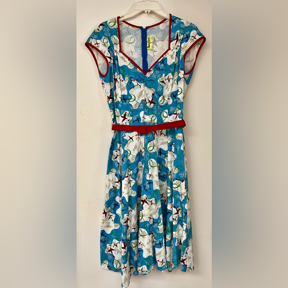 Pinup Couture Mary Blair ‘Bon Voyage’ Dress with Red Belt and Airplane Pattern